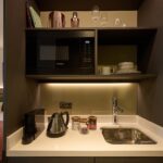 The Resident Edinburgh's mini-kitchen comprised of sink, mini-fridge, microwave and Nespresso Machine