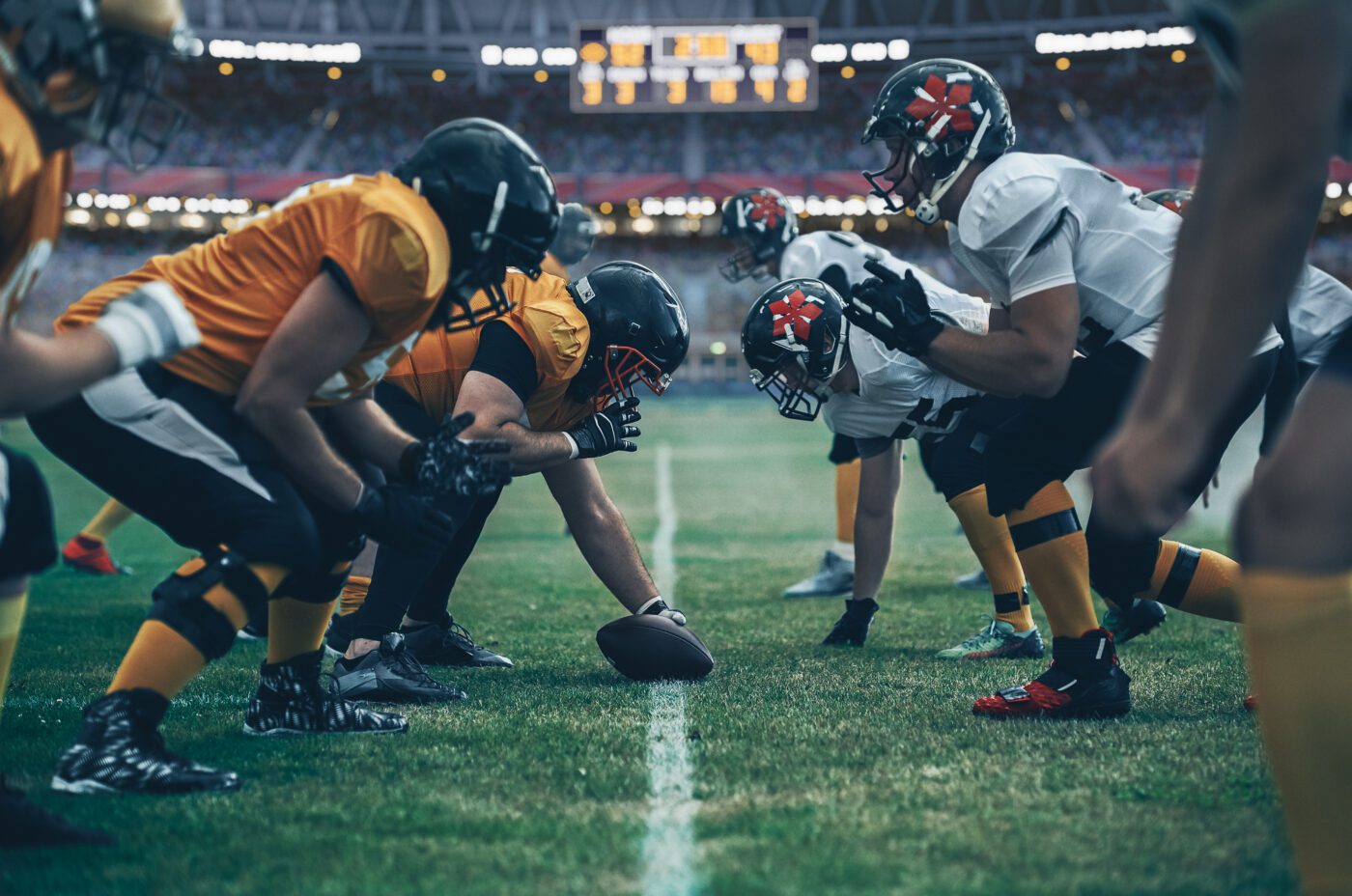 NFL Football players playing American Football at Tottenham Hotspur stadium during their London tour.